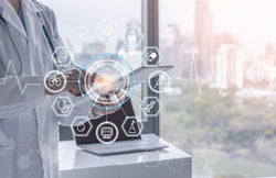 A medical professional in a white coat holding a digital tablet. Digital icons related to health overlay the tablet.